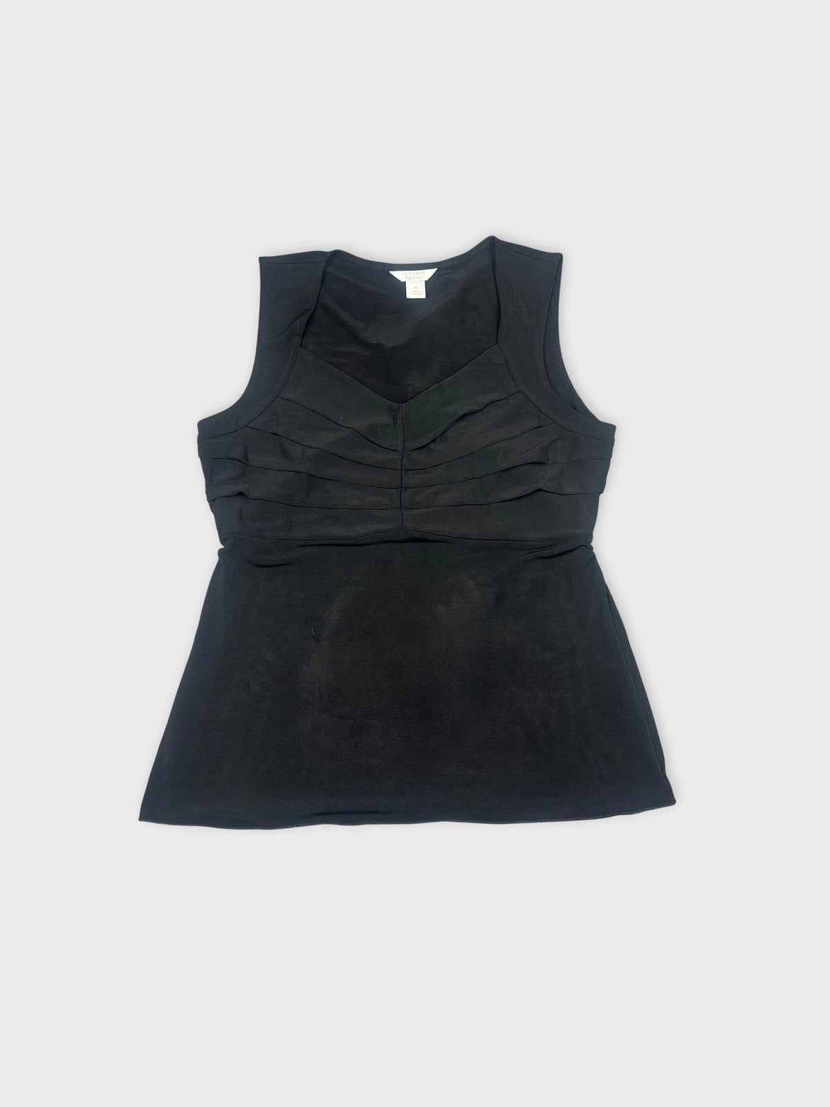 Front view of a black sleeveless top with layered detailing.