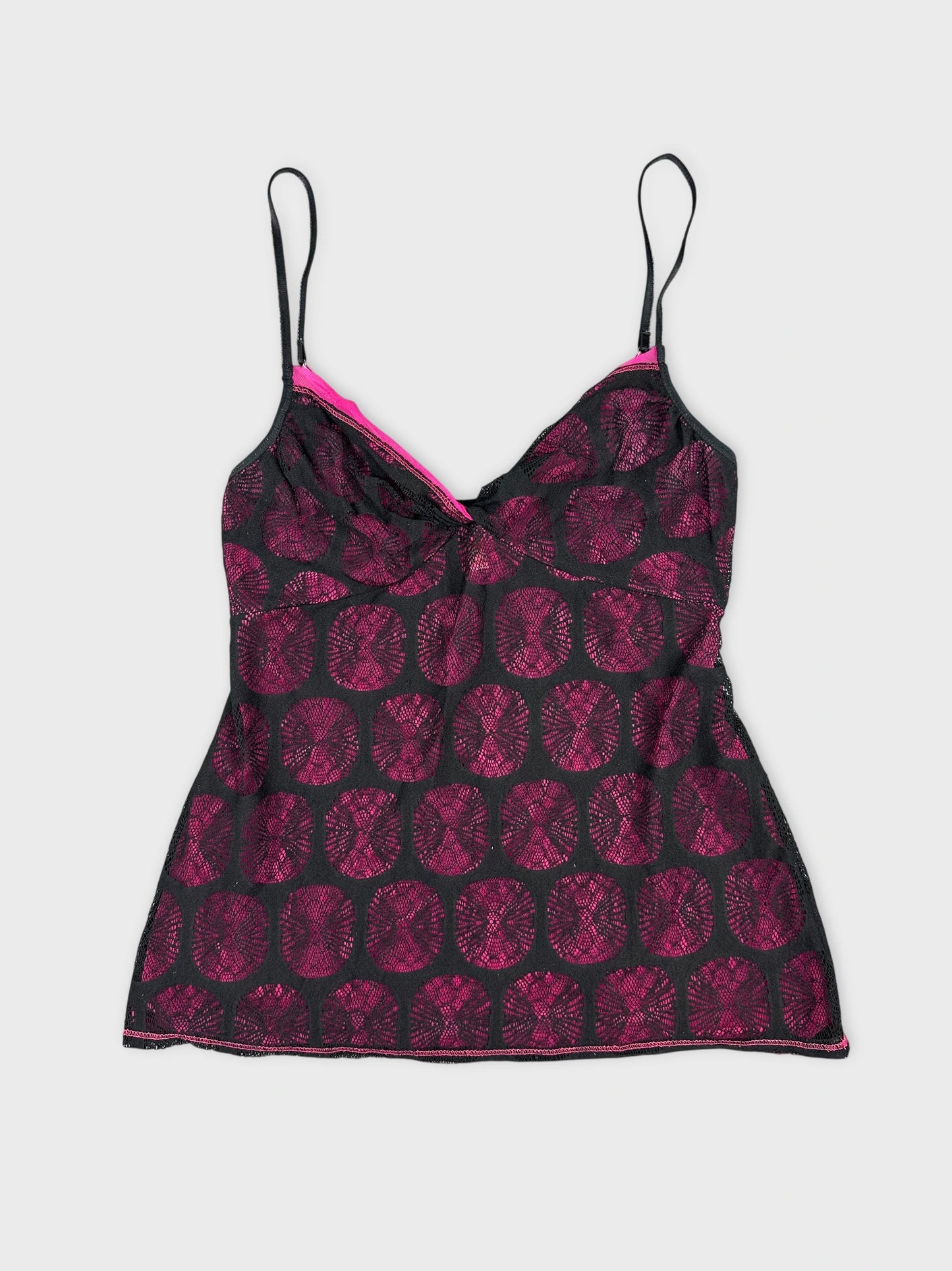 Black and pink vintage top with circular lace pattern front view.