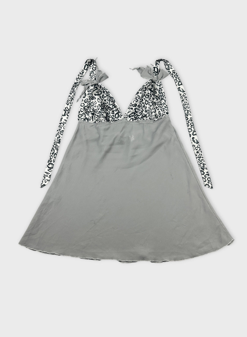 Front view of a gray top with leopard print detail on straps.