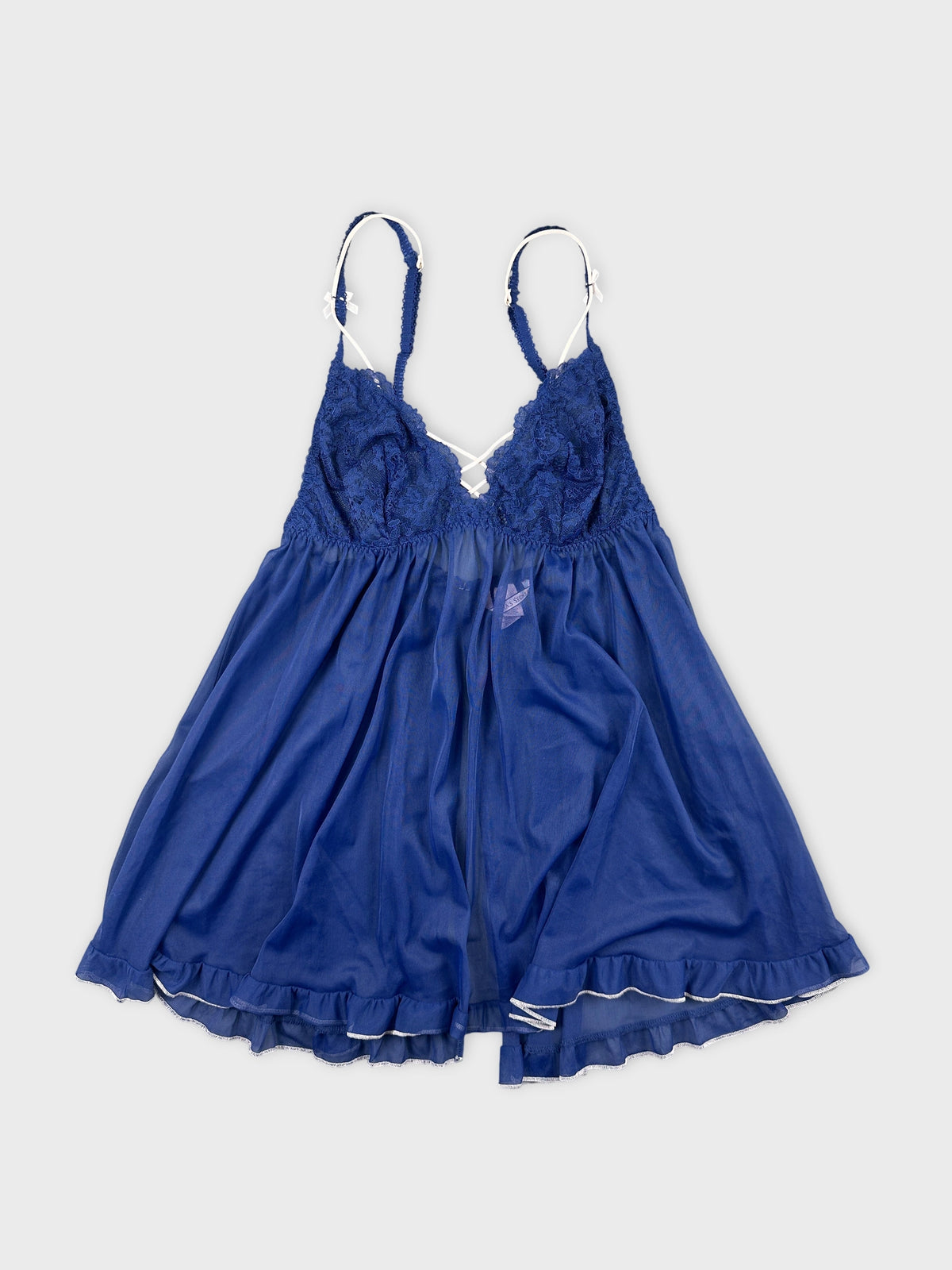 Front view of a blue vintage upper body top with lace detailing.