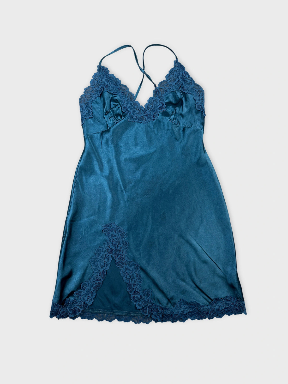 Front view of a teal satin camisole with lace trim.