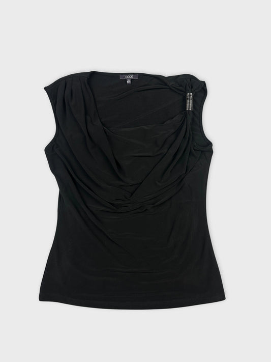 Front view of a black draped women's top with detailed neckline.
