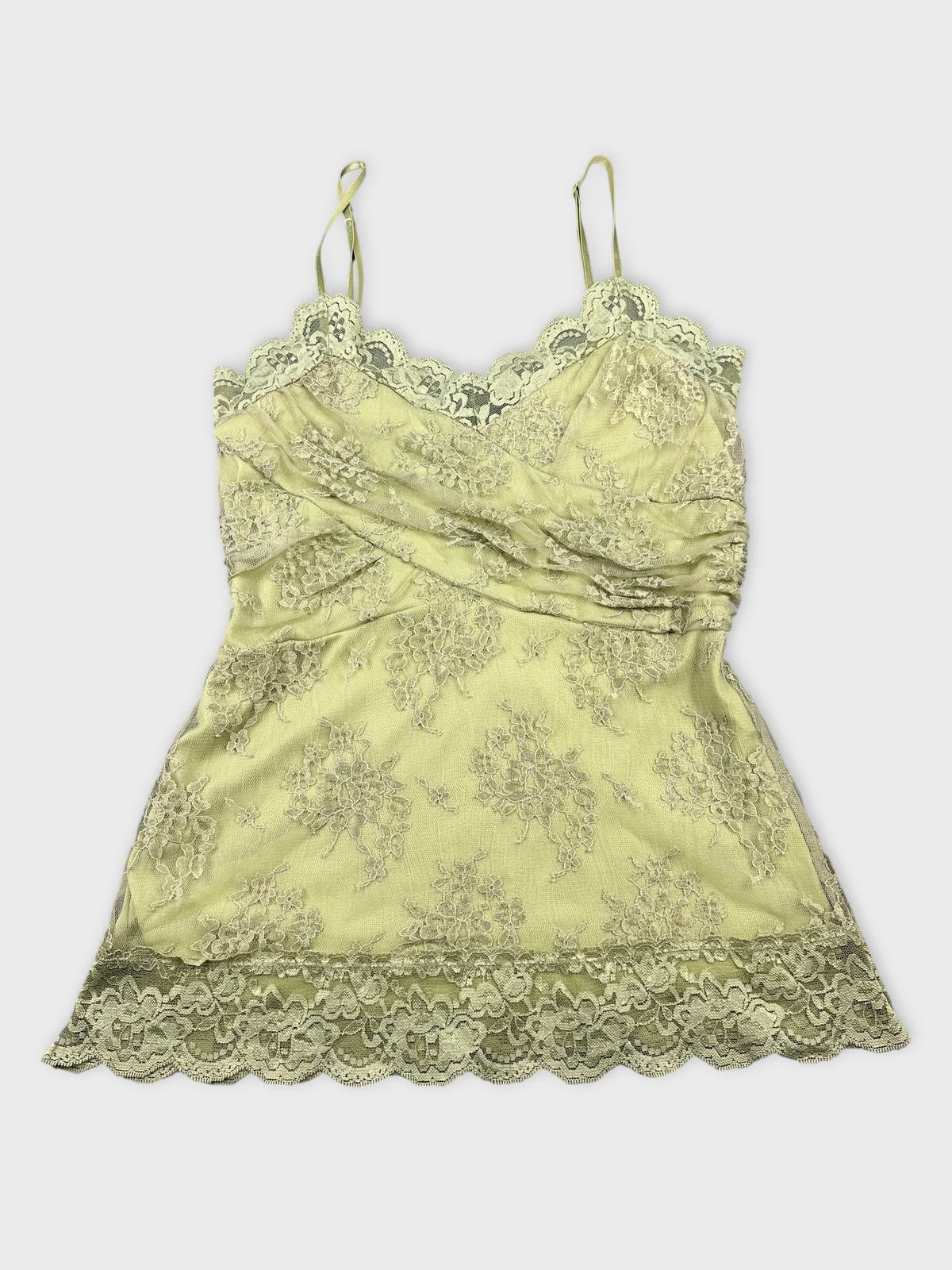 Front view of a pale green lace-trimmed camisole with floral pattern.