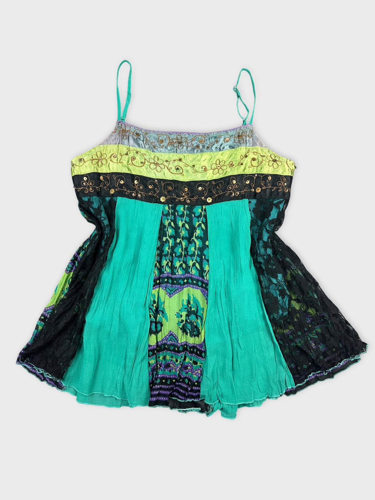 Front view of a multicolored women’s top with a floral trim and black lace.