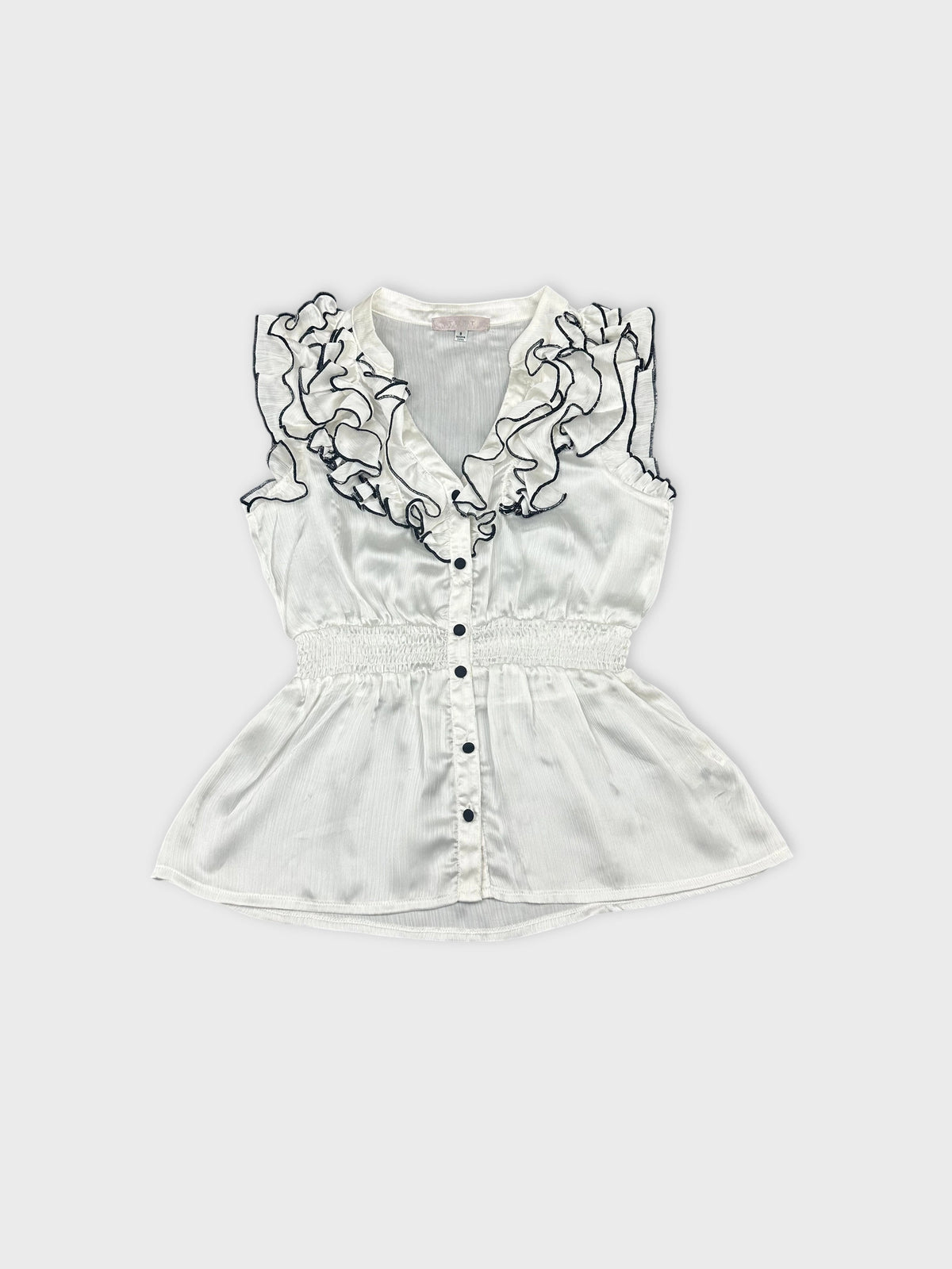 Front view of a white ruffled blouse with a button-up design.