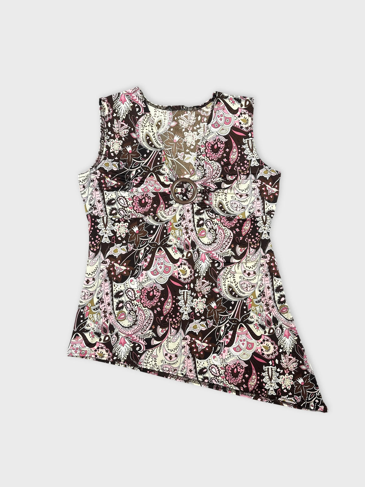 Front view of a brown vintage top with paisley pattern and circular detail.