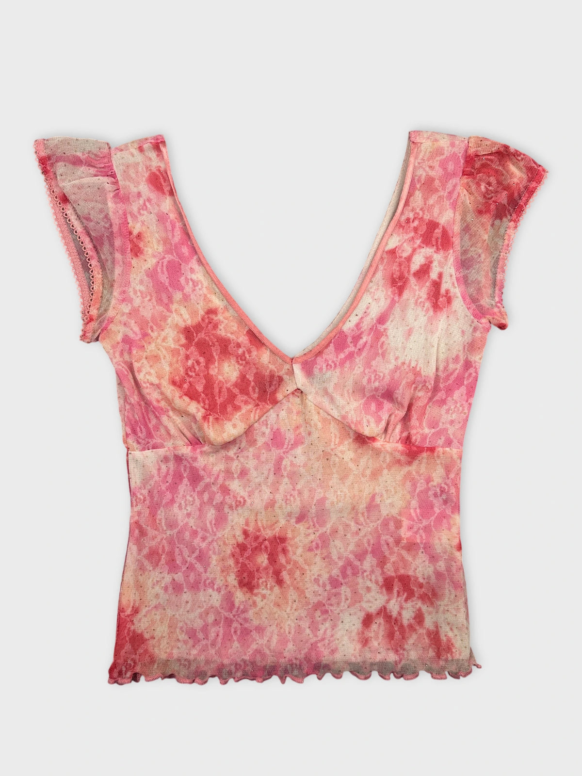 Pink tie-dye top with scalloped trim front view