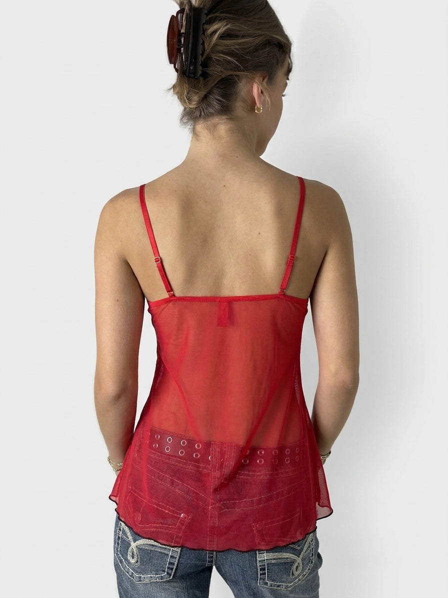 Back view of a red upper body top with a sheer mesh design.