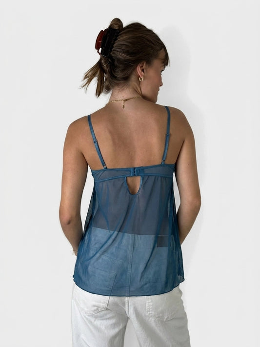 Back view of a sheer teal upper body top featuring a keyhole detail.