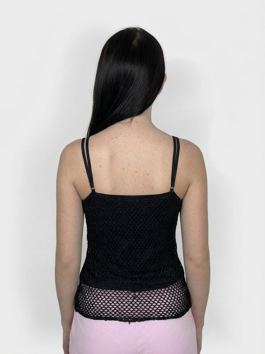 Back view of a black mesh women’s upper body top with thin straps.