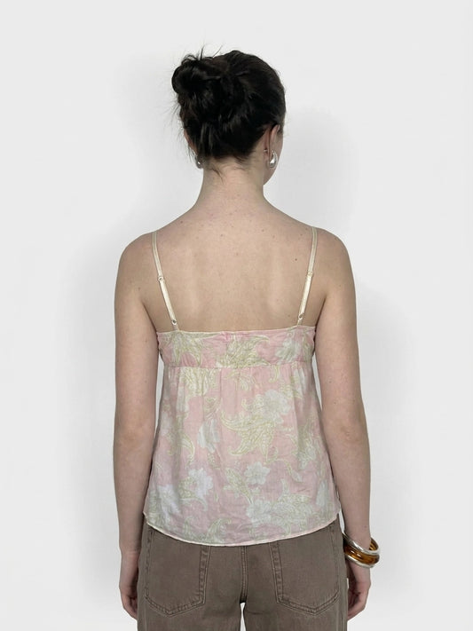 Back view of pink floral women’s upper body top with spaghetti straps.