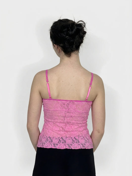 Back view of a pink lace upper body top with thin straps.
