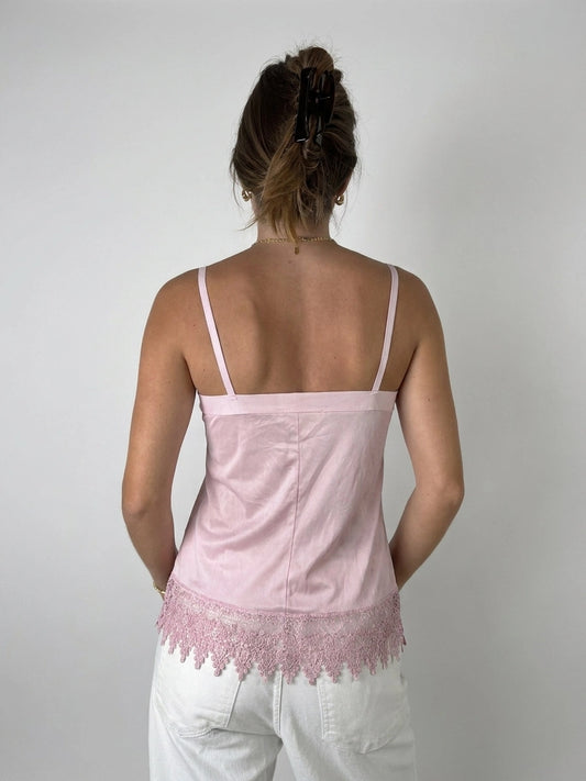 Back view of a pink camisole top with lace trim.