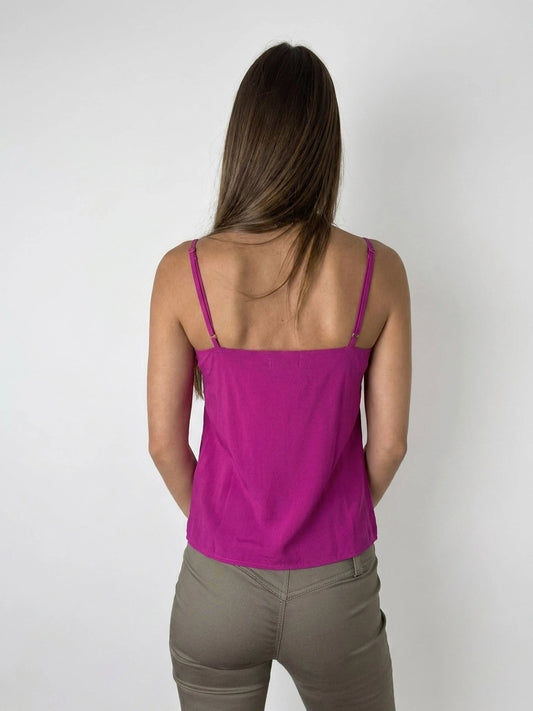 Back view of a pink upper body top with thin straps.