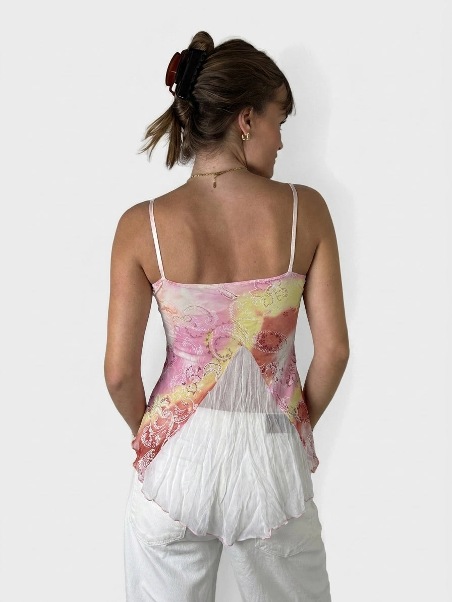 Back view of a pink and white floral top with spaghetti straps.