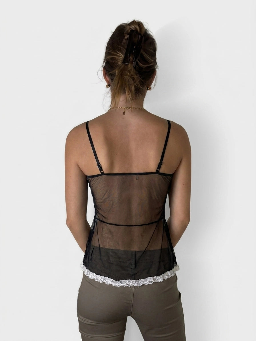 Back view of a black upper body top with lace trim.