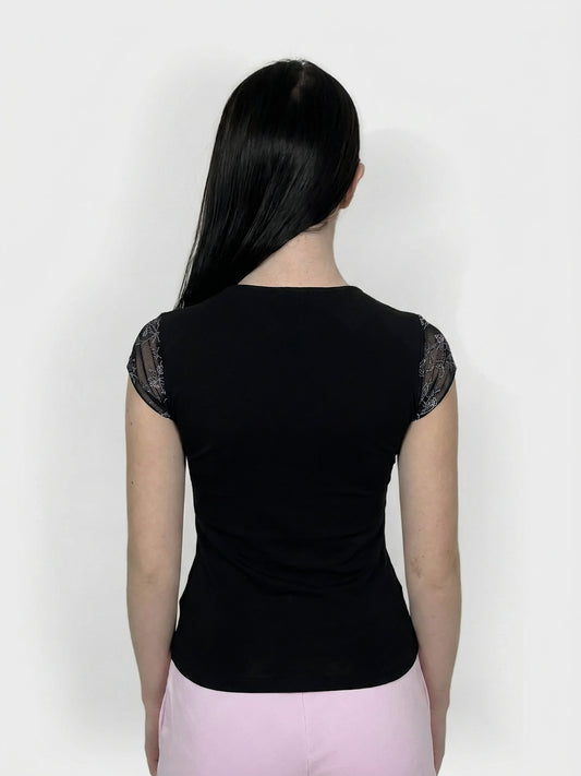 Black upper body top with lace trim, seen from the back view.