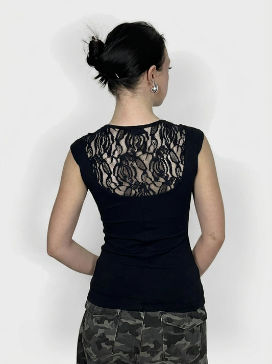 Back view of a black women's top featuring a lace back detail.