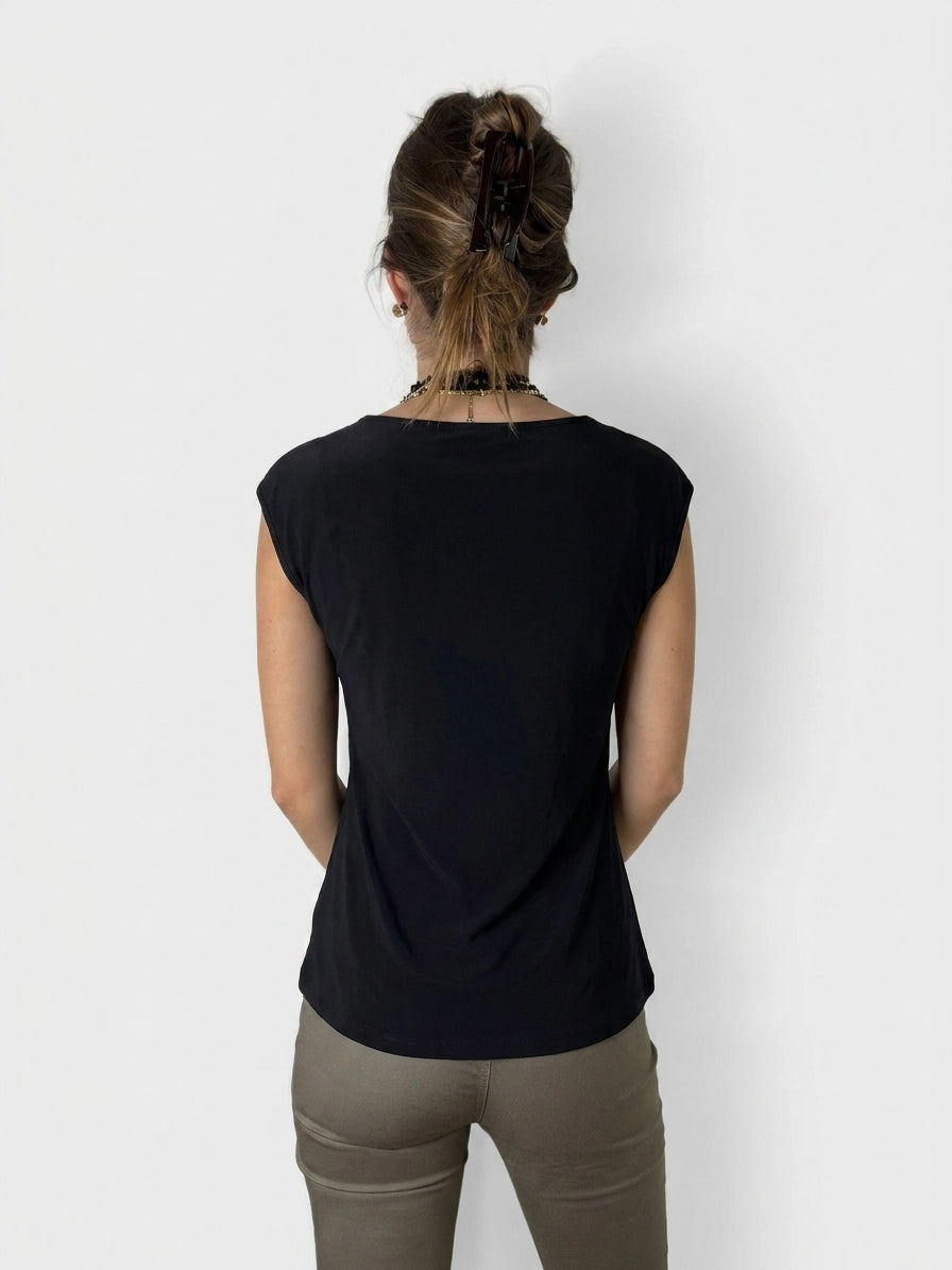 Back view of a black upper body top with cap sleeves.