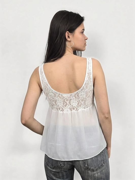 Back view of a white women’s tank top with lace detail.