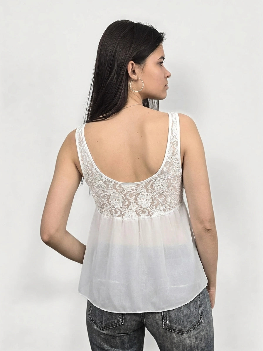 Back view of a white women’s tank top with lace detail.