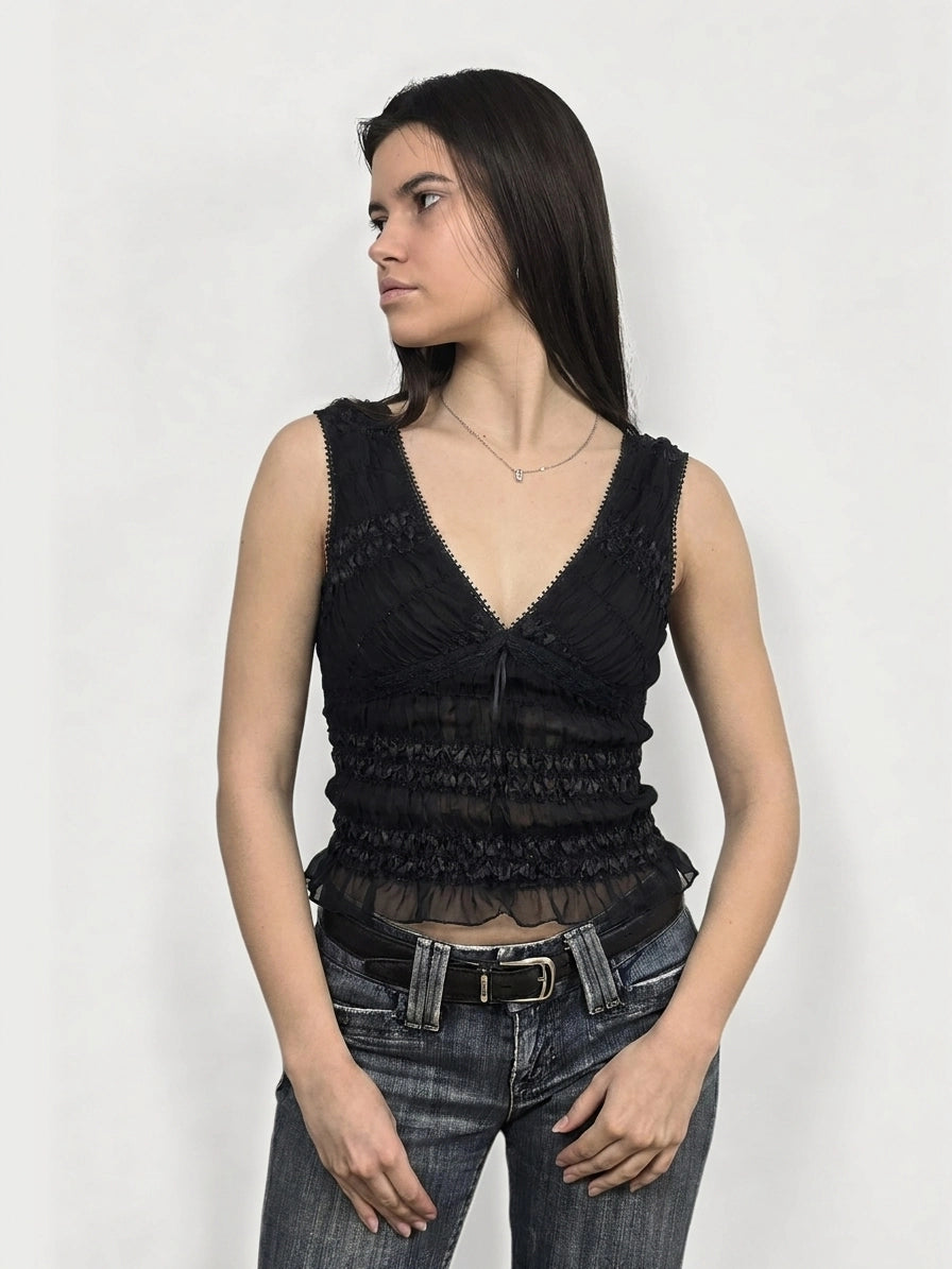 Black upper body top with ruffled texture, displayed in front view.