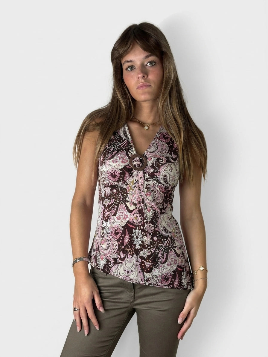 Front view of a brown paisley print women's top with a halter neck.