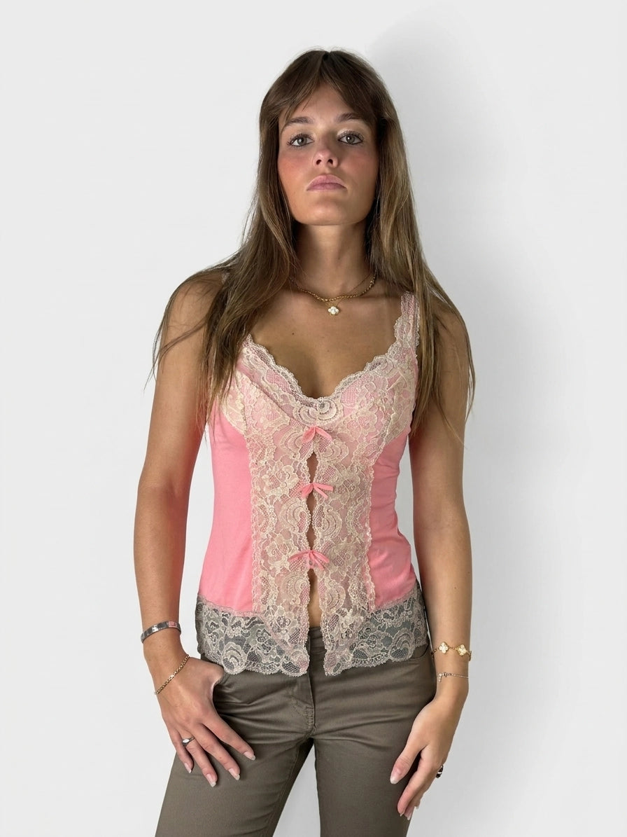 Front view of a pink lace-trimmed women's top with buttons.
