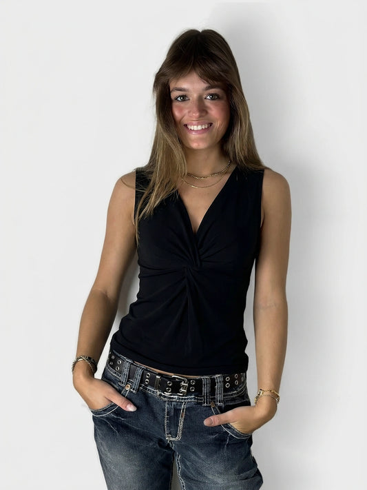 Black women's top with a twist detail, front view.
