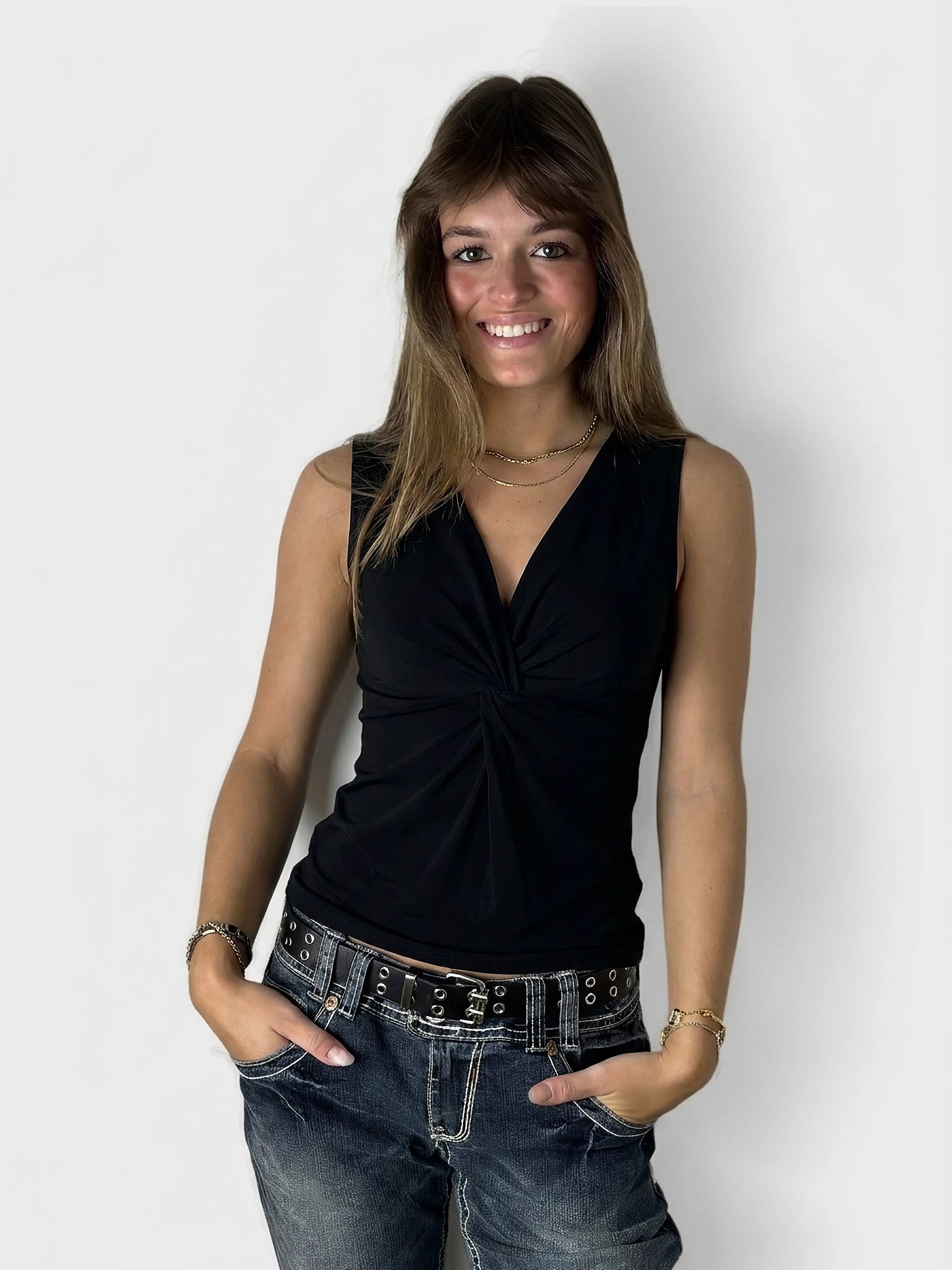 Black women's top with a twist detail, front view.