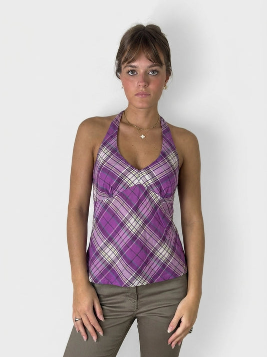 Front view of a purple plaid halter top with a fitted shape.