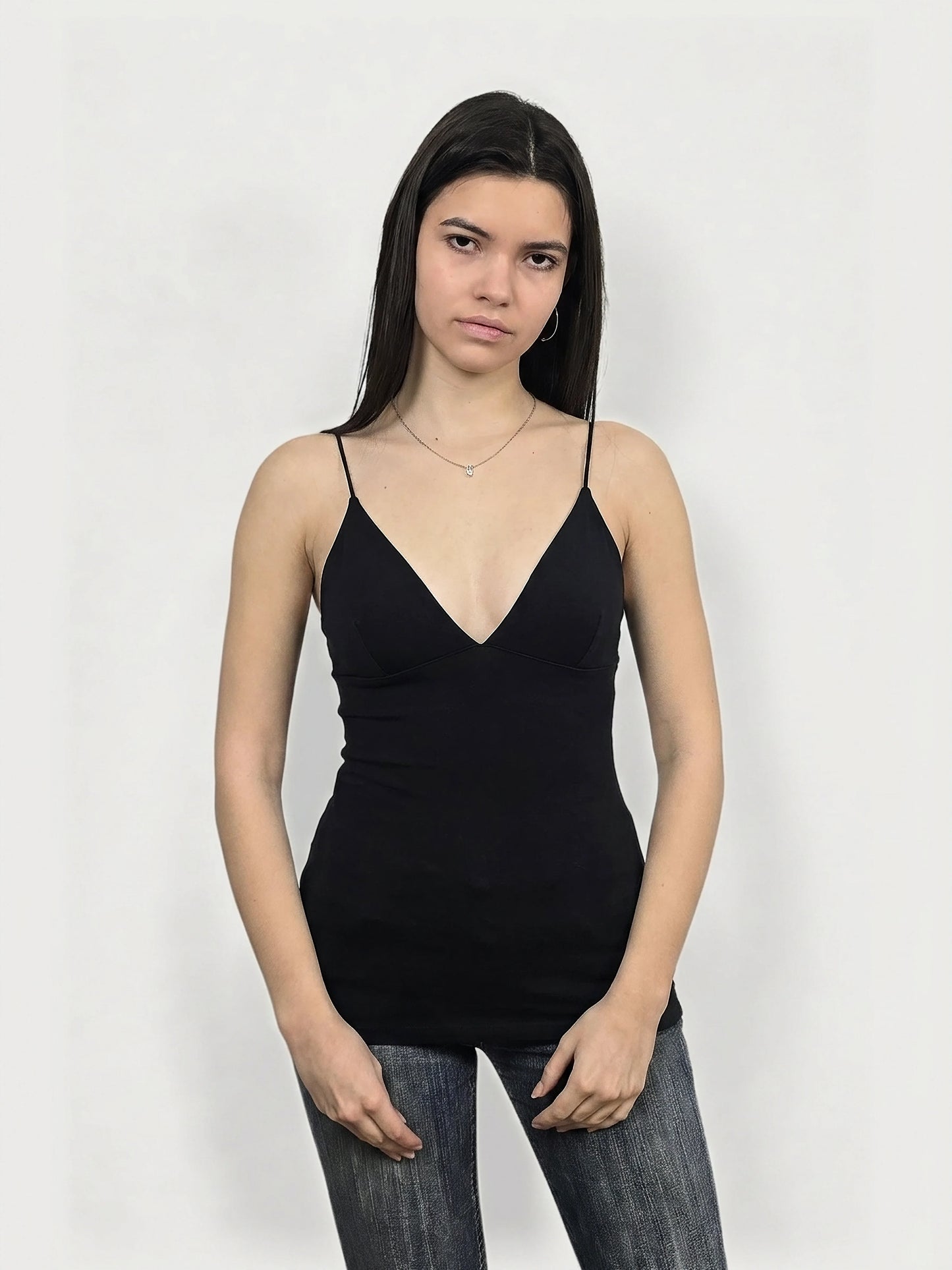 Black women's upper body top with a deep V-neck, front view.