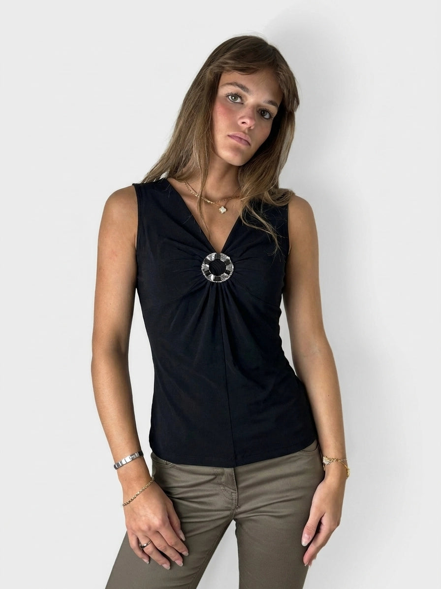 Black upper body top with a circular detail, front view.