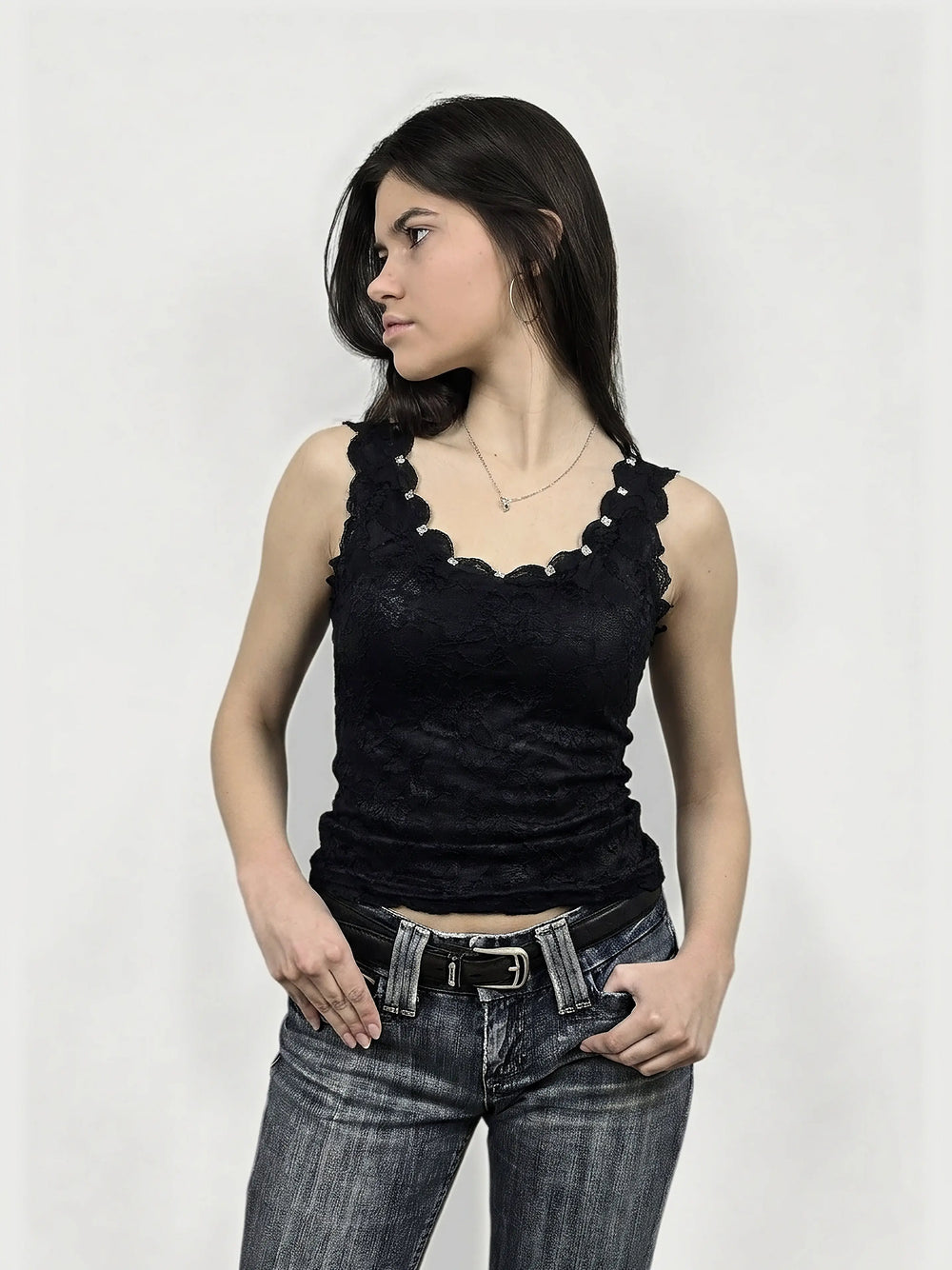 Front view of a black lace women’s top featuring scalloped trim.