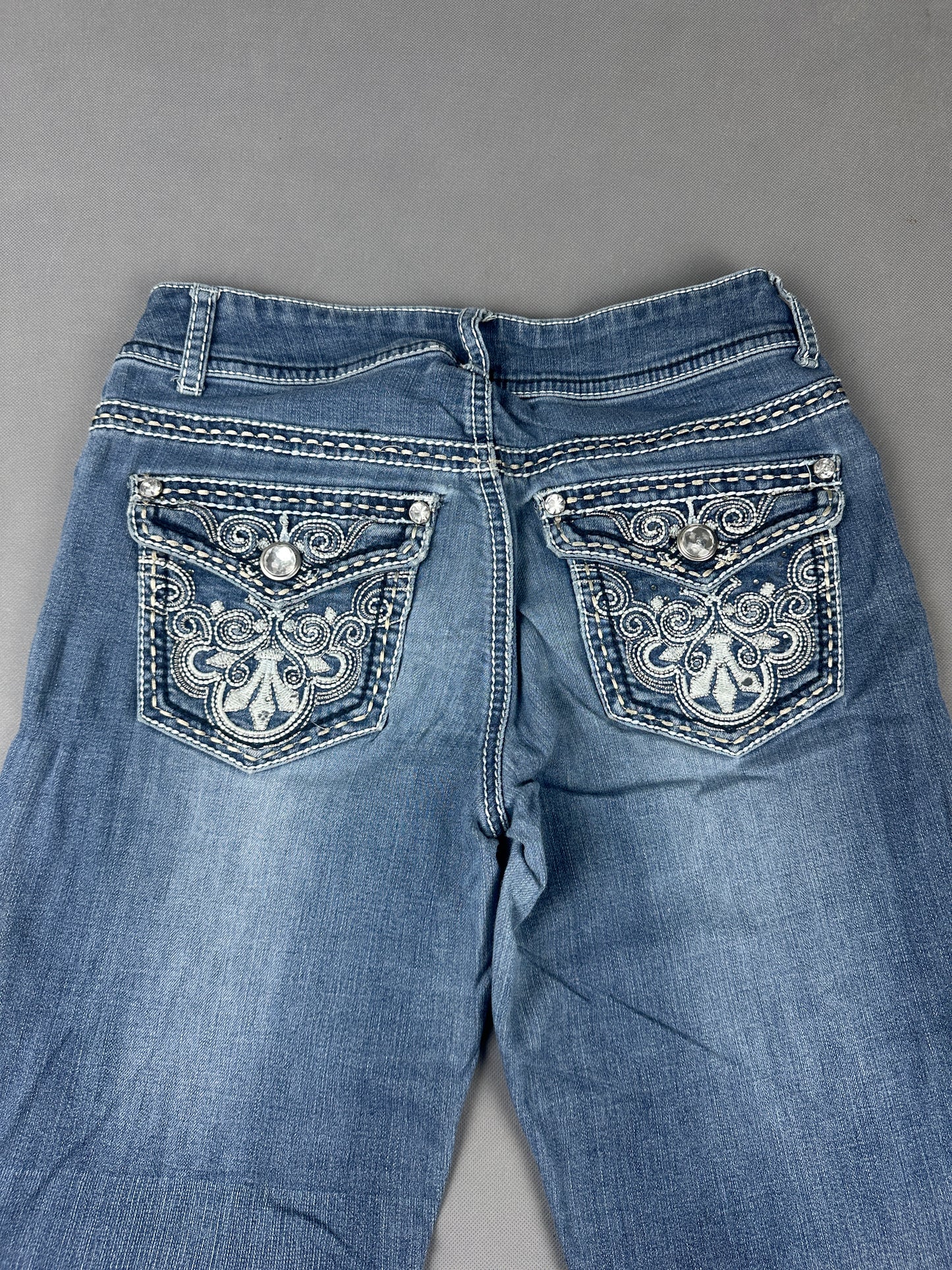 Stylish Denim Jeans with Unique Back Pocket Detail (W28)