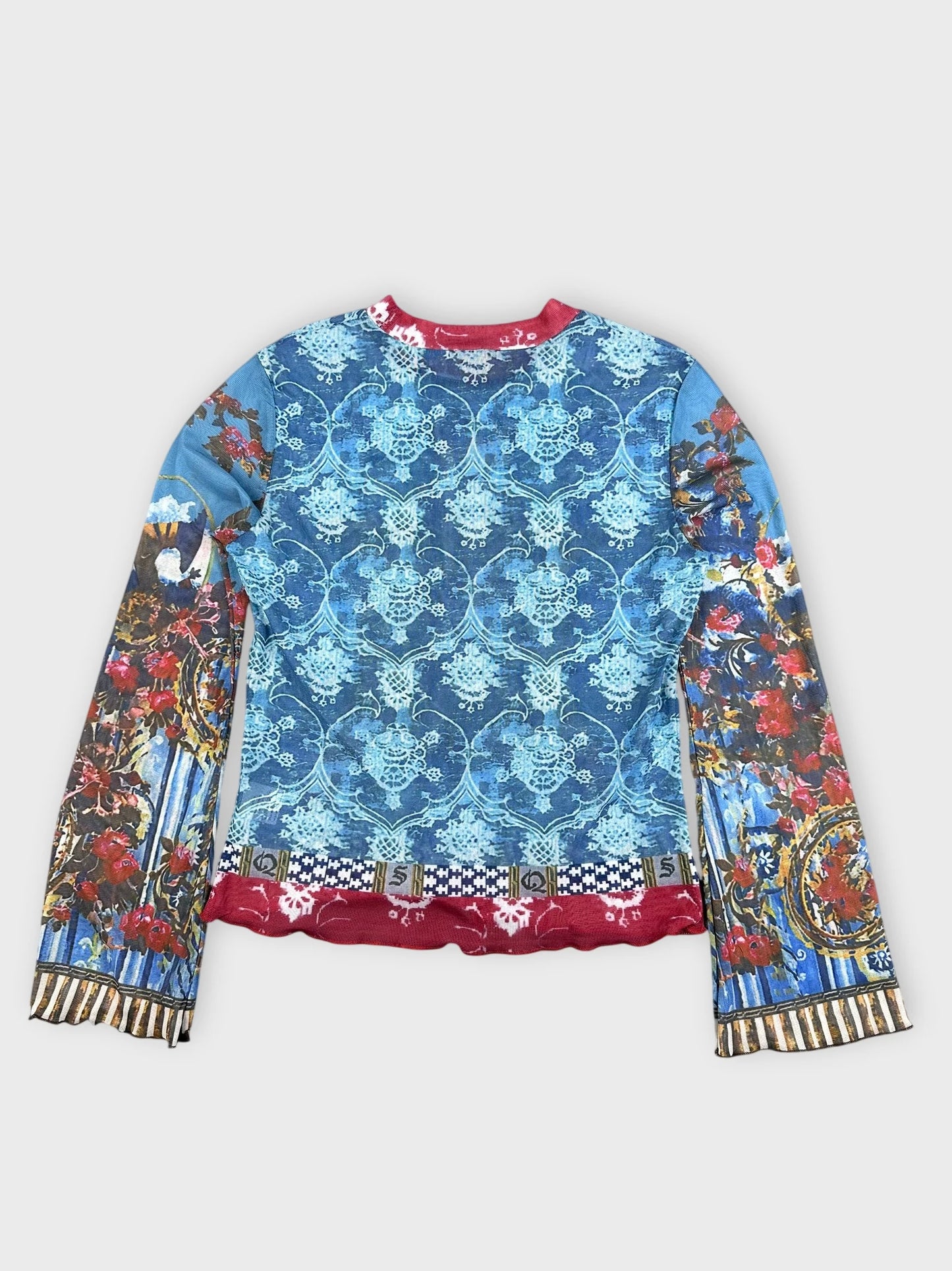 Back view of blue mesh top featuring baroque print and red trim.