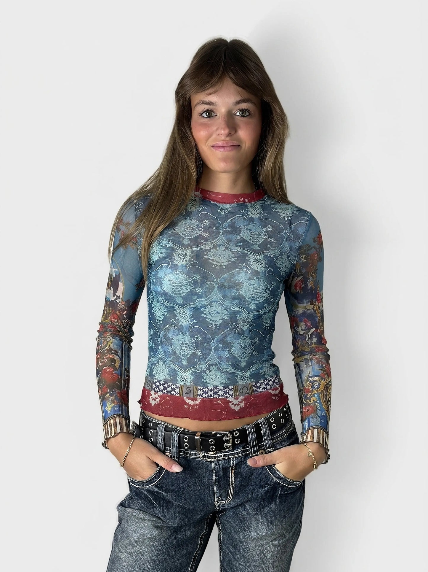Front view of a blue mesh long-sleeve top featuring a floral pattern.