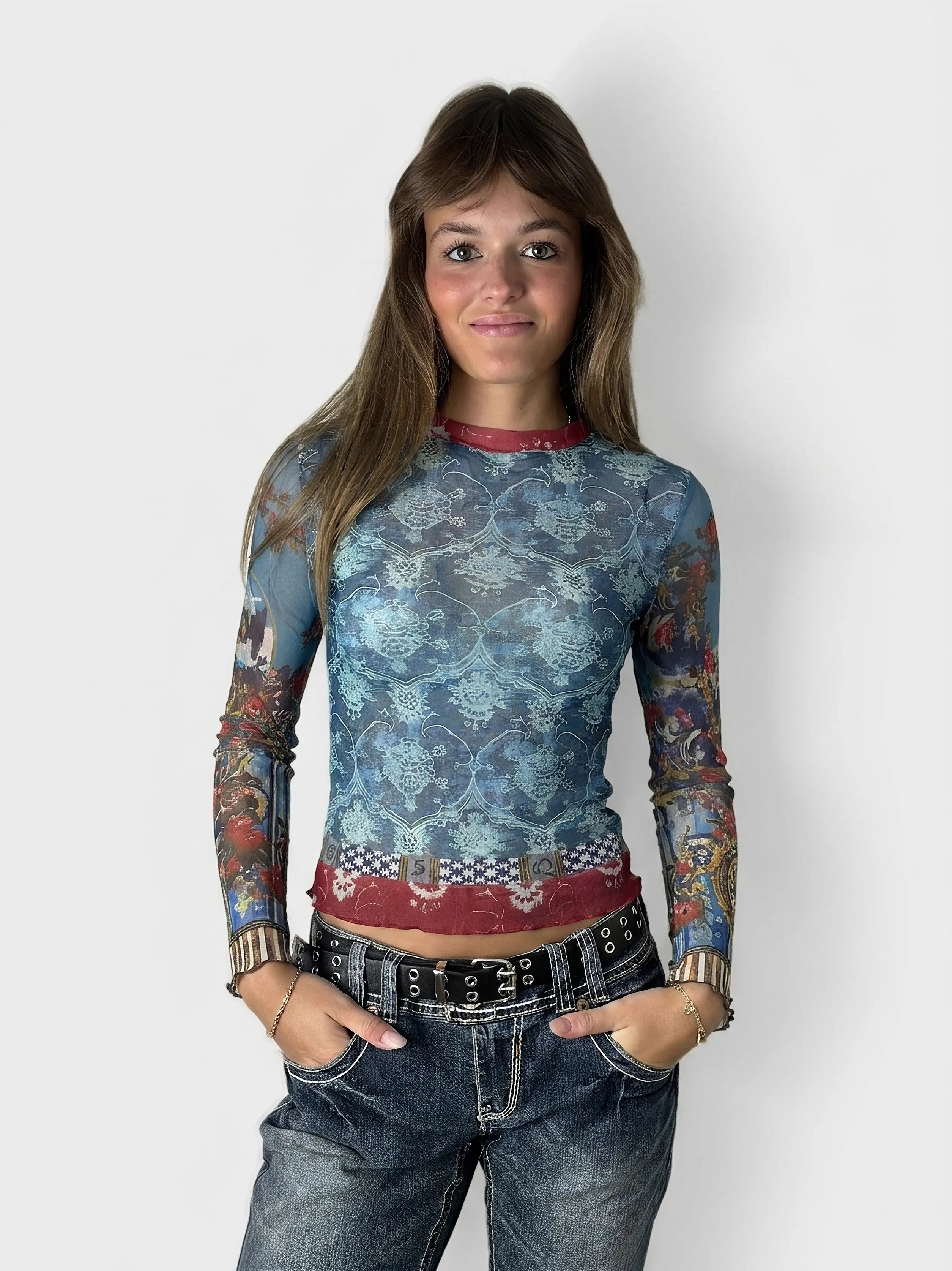 Front view of a blue mesh long-sleeve top featuring a floral pattern.