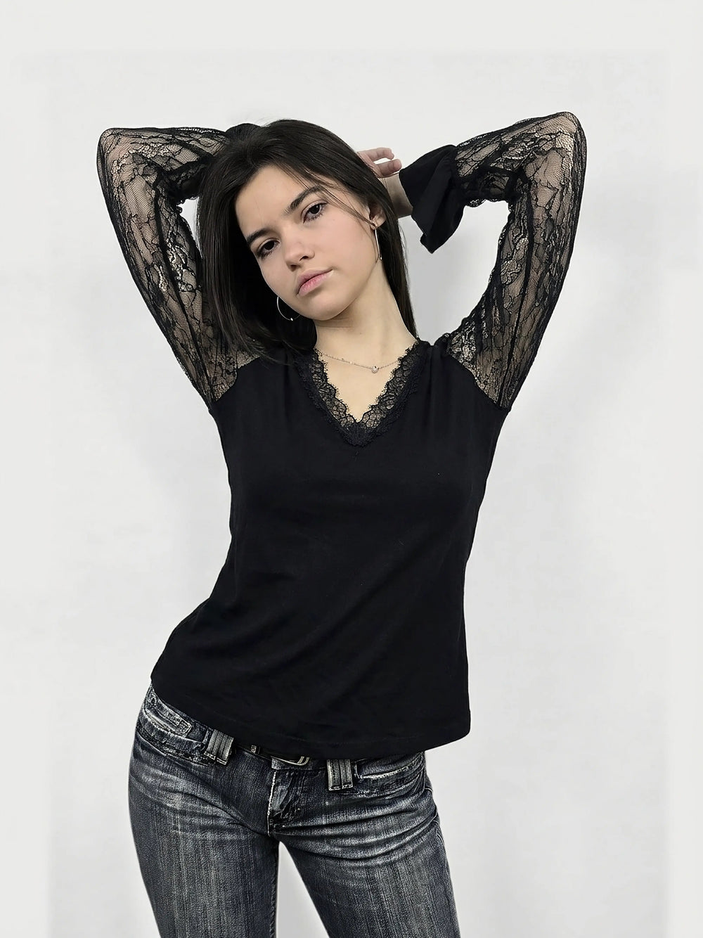 Front view of a black lace sleeve body shirt featuring lace trim details.