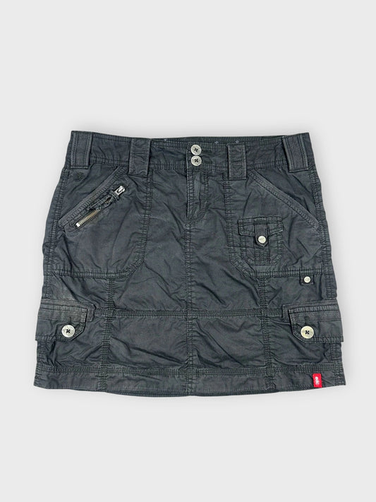 Black mini skirt front view featuring utility pockets and zipper detail