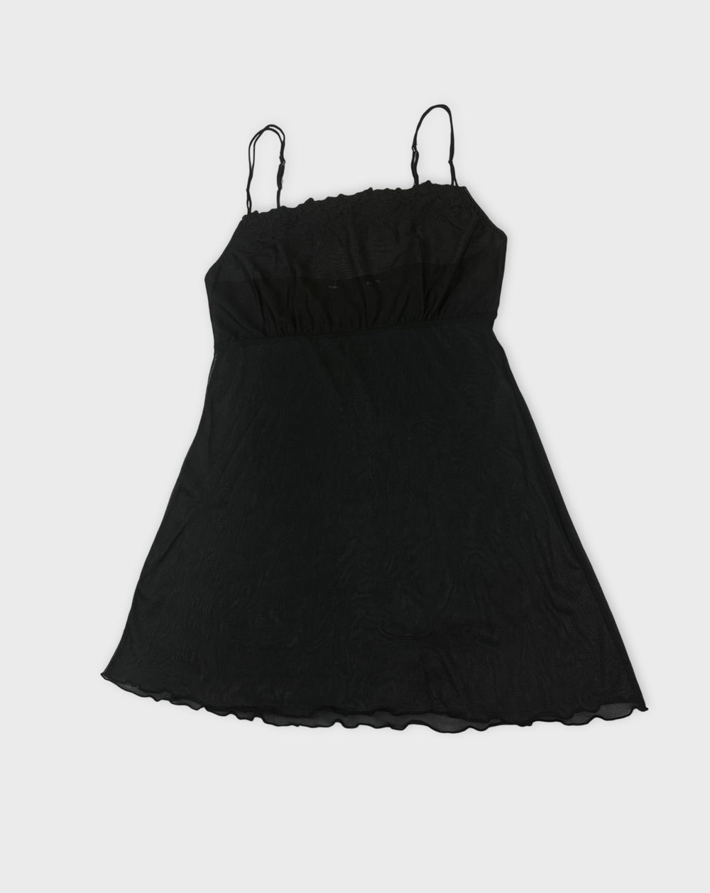 Black sheer slip dress with spaghetti straps front view featuring a relaxed fit.