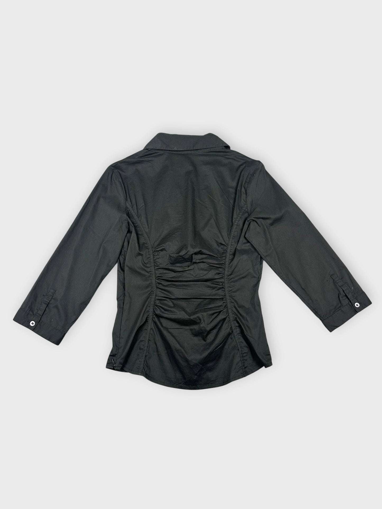 Black short sleeve shirt with ruching back view showcasing smooth silhouette.