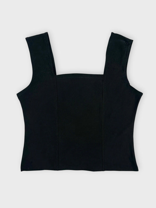 Back view of a black sleeveless top with a square neck and structured design.
