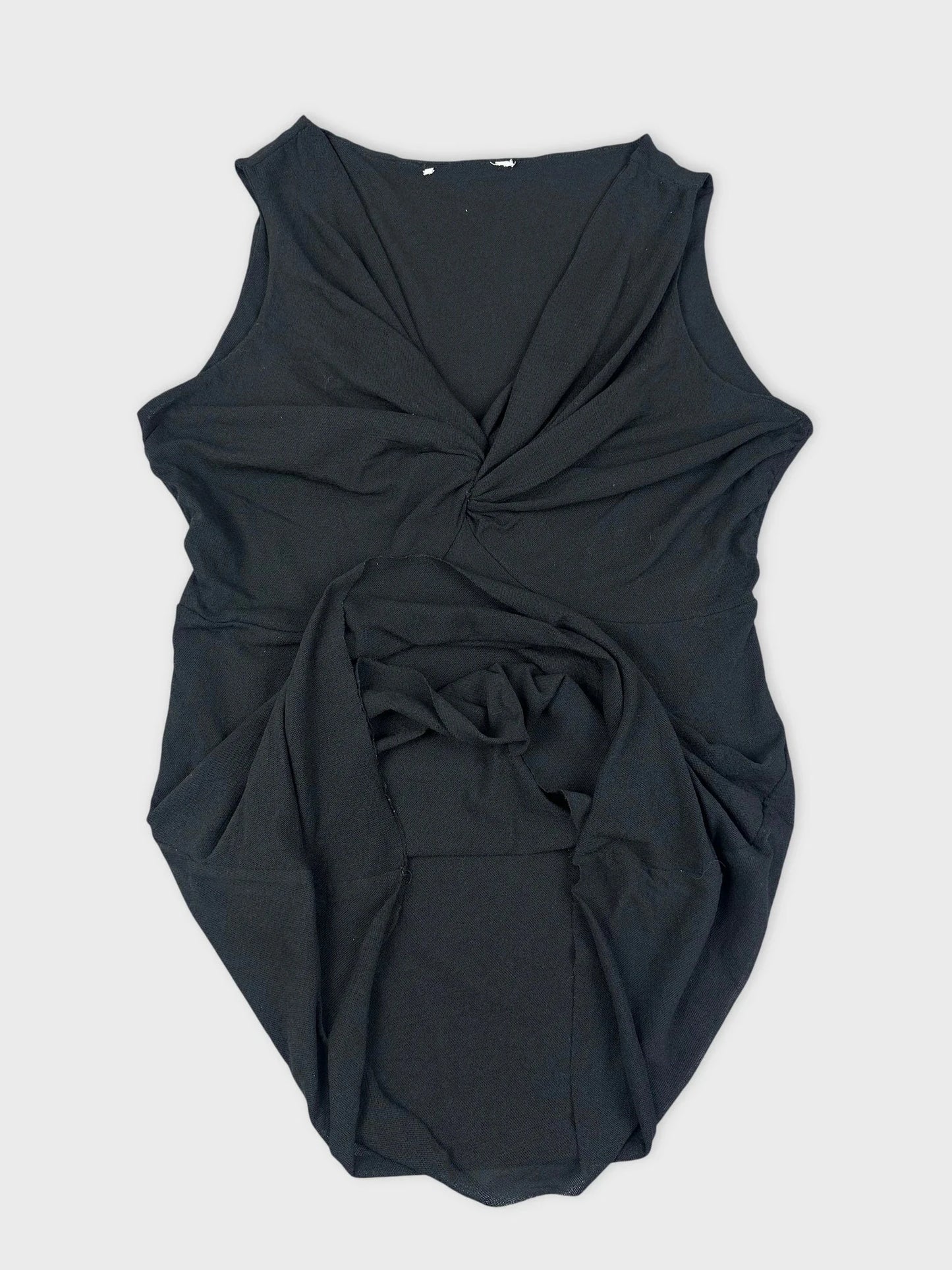 Black sleeveless top with twist detail, showing fabric draping in detail view.
