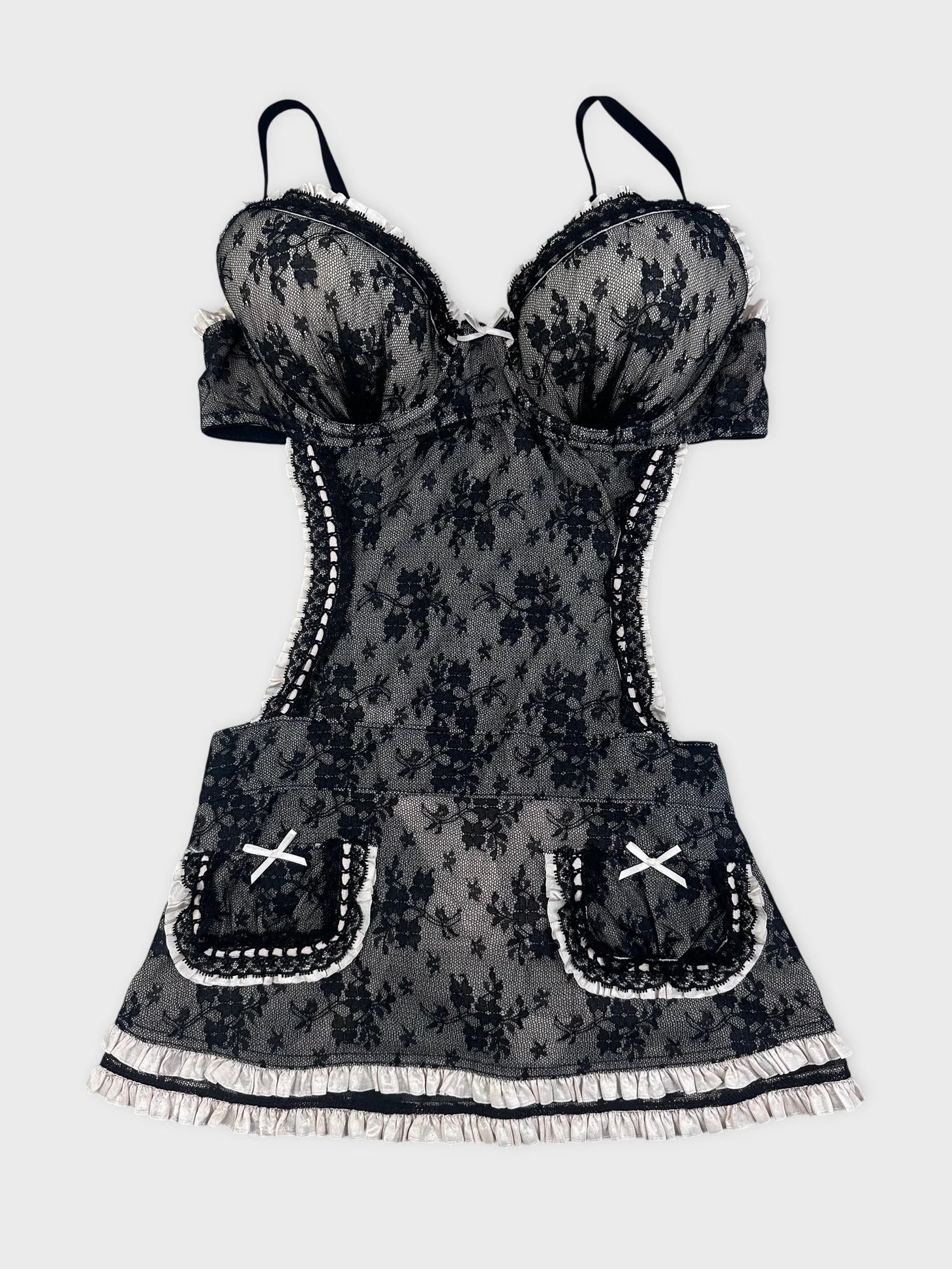 Front view of a black lace top with ruffled straps and pocket detail.