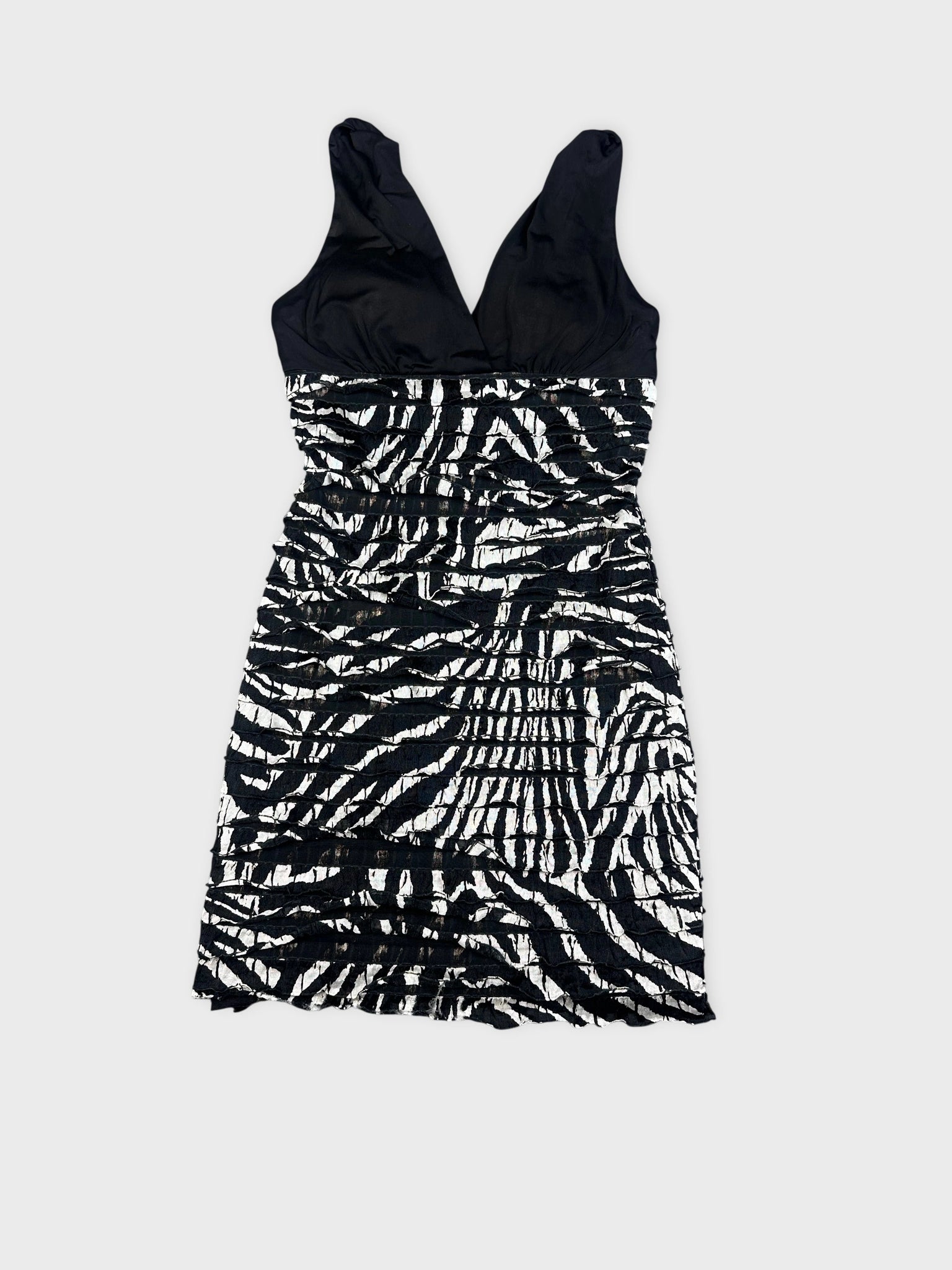 front view of a black and white zebra striped mini dress with gathered details