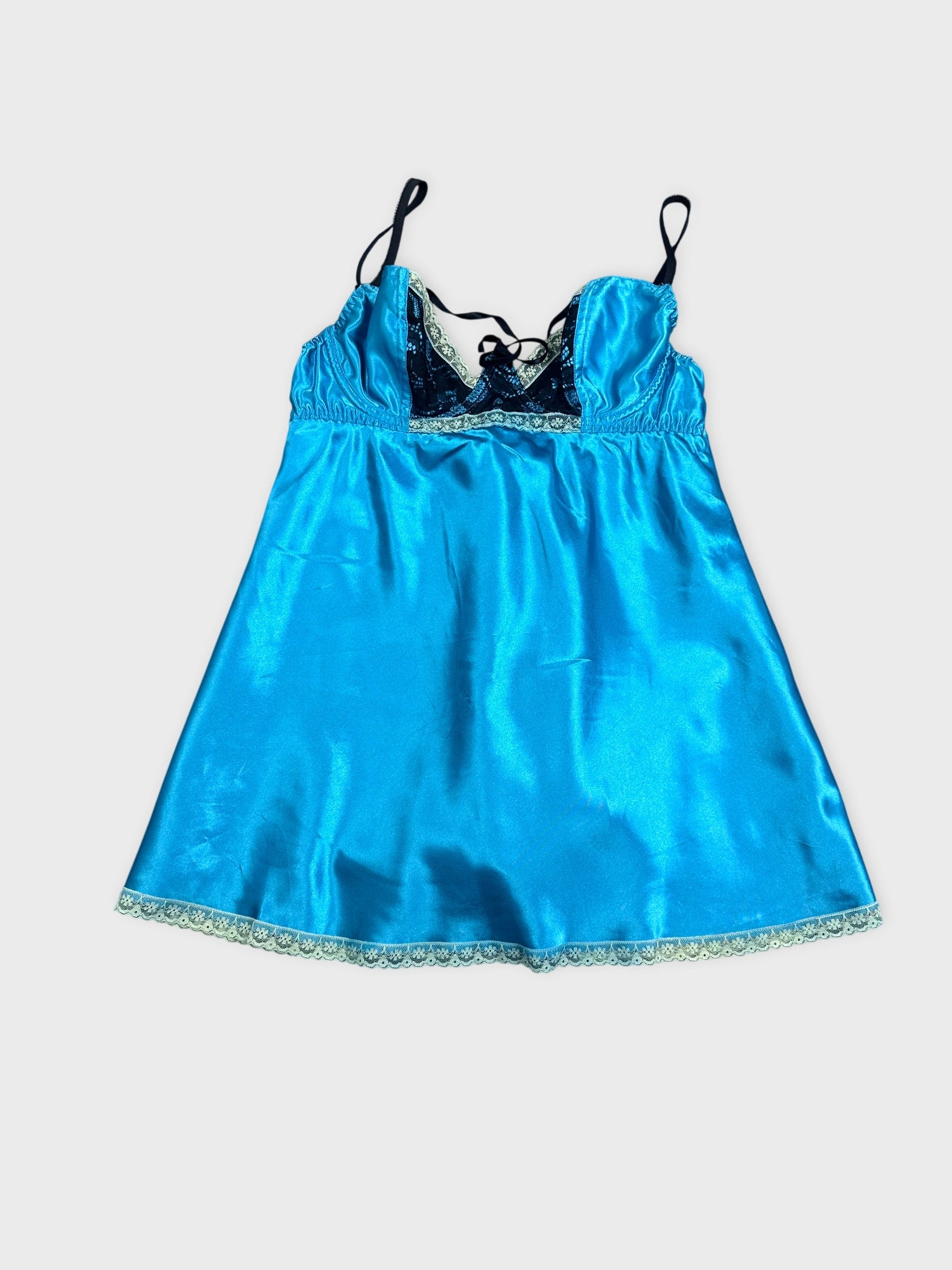 Blue satin baby doll dress with lace trim front view.