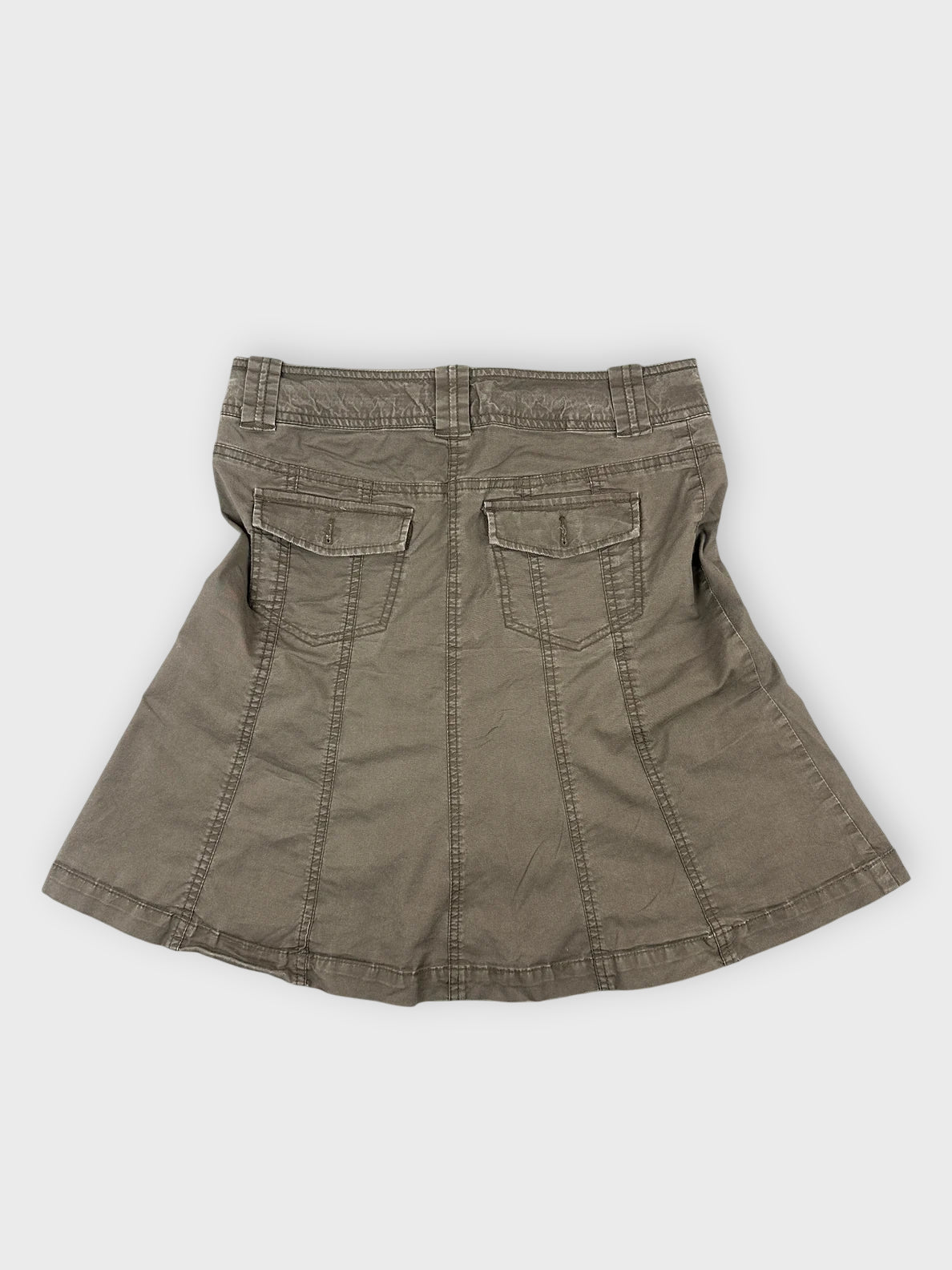Back view of a brown cotton mini skirt featuring two back pockets.