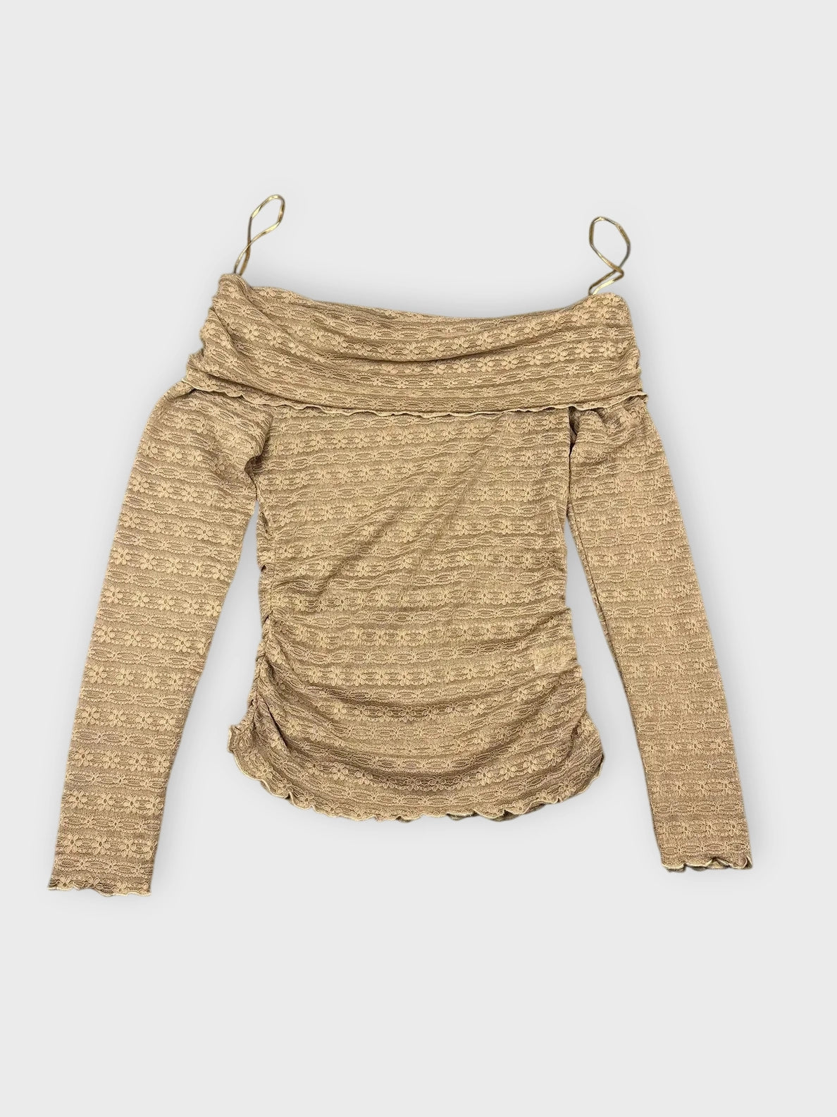Back view of a brown long sleeve sheer top with textured pattern.