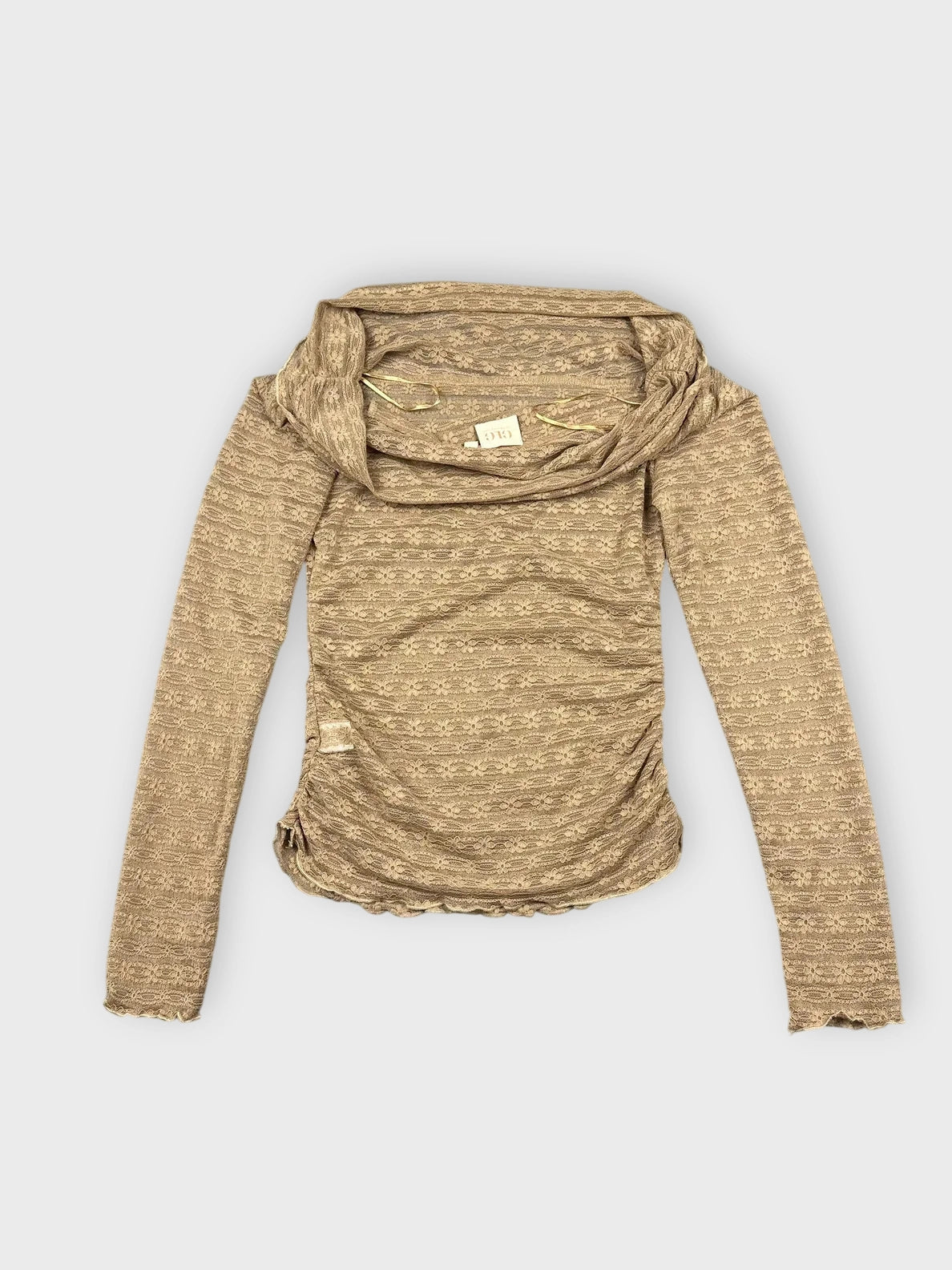 Detail view of a brown long sleeve sheer top with textured pattern.
